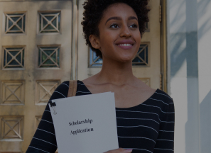 Student with scholarship application smiling